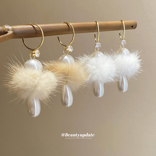 Main image 1 showing fluffy white pom-poms, pearl-like drops, and slim gold-tone fish hooks, styled product view