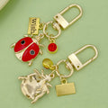Dolphin and Turtle Charm Keychains Featuring Dolphin Across 7 Pictured Variations view 4