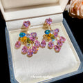 Pink Heart Crystal Floral Cluster Stud Earrings with Polished Metal Details view 3