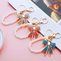 Full Crystal Bow Keychains with Plain Pearl Strand and Fortune Loop Options view 4