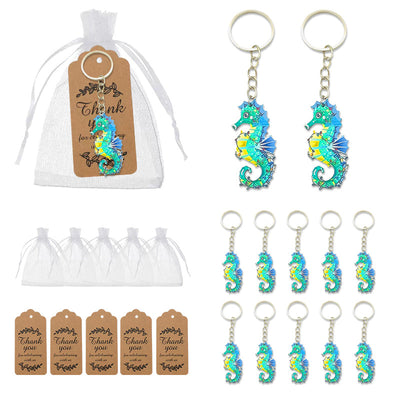 White organza bags, brown thank-you tags, and multiple colorful seahorse keychains arranged together.