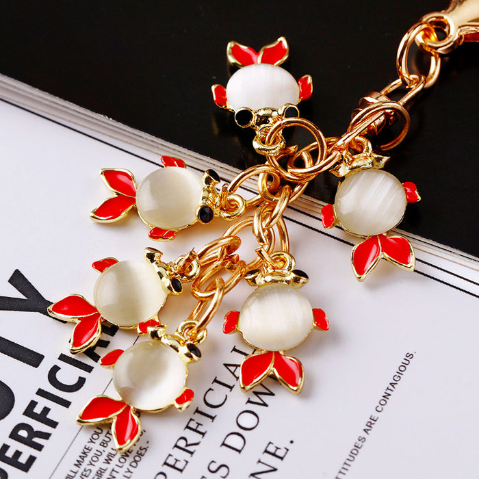 Six Fish Moonstone Keychains in Red Blue and Assorted Color Options