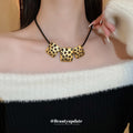 Gold Tone Three Plate Necklace With Small Black Flower Pattern view 4