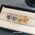 Interlocking Knot Stud Earrings in Gold Tone and Silver Tone view 3