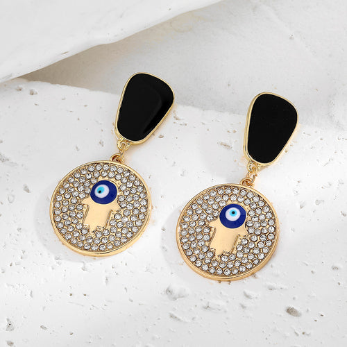 Close-up showing the colors and surface details of gold Tone Black Geometric Evil Eye Stud Drop Earrings in Ten Designs