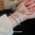 Double Band Bow Open Bangle In Iridescent Gold Gold Or Silver Tone view 4