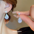 Silver Tone Round Crystal Cluster Necklace And Iridescent Teardrop Earrings view 3