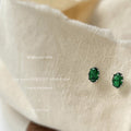 Silver Tone Emerald Green Oval Stone Clear Halo Stud Earrings view 1