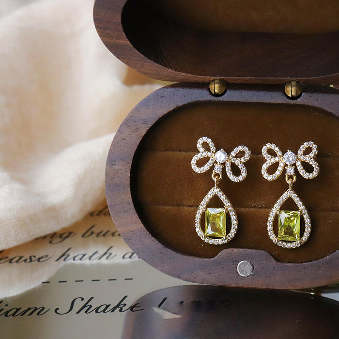 Green Teardrop Crystal Bow Stud Earrings With Polished Metal Details
