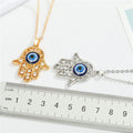Crystal Hamsa Blue Evil Eye Pendant Necklaces in Two Finishes view 2