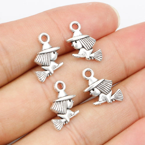 miniature witch broom charm arranged together on a white background