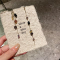 Asymmetric Black and Amber Beaded Gold Tone Drop Earrings view 4