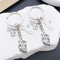 Two Silver Tone Ambulance Syringe and Heart Keychains view 1