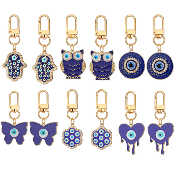 Twelve Piece Gold Tone Owl Heart Butterfly Evil Eye Keychain Set