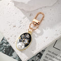 Gold Tone Pearl and Rhinestone Oval Clip Keychains in Six Colors view 7