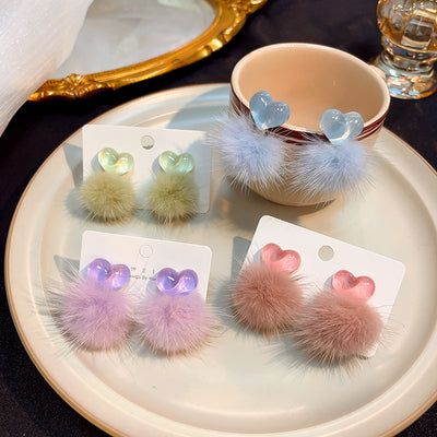 pink, purple, green, and blue heart pom-pom earrings together