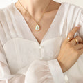 Teardrop White Shell Pendant Necklace Blue Center Stone view 3