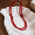 Layered Red Beaded Necklace with Knotted Strands and Gold Tone Accents view 2