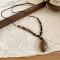 Brown Beaded Cord Necklaces with Botanical Pendants view 4