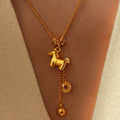Gold Tone Horse Coin and Bell Tassel Pendant Necklace view 1