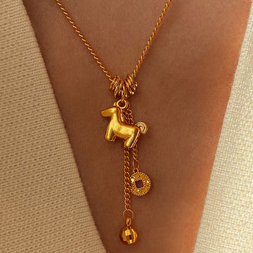 Gold Tone Horse Coin and Bell Tassel Pendant Necklace