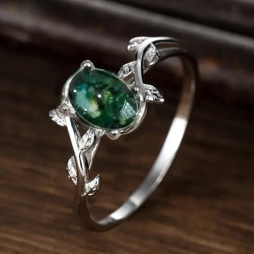 Angled silver green cabochon vine leaf ring side prong detail