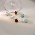 White Blue and Red Double Sided Heart Huggie Earrings view 1