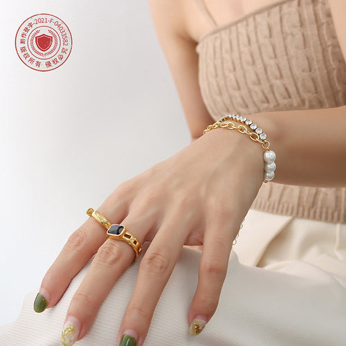 Gold pearl zircon double bracelet worn with black stone ring copyright seal