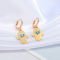 Gold Tone Hamsa Evil Eye Huggie Drop Earrings with Enamel Detail view 5