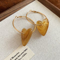 Gold Tone Hoop Earrings with Resin Heart Drops in Three Colors view 8