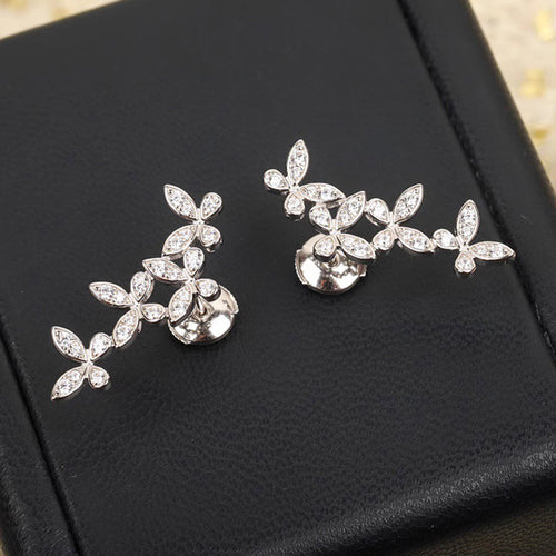 Pair of butterfly crawler studs with posts on black box