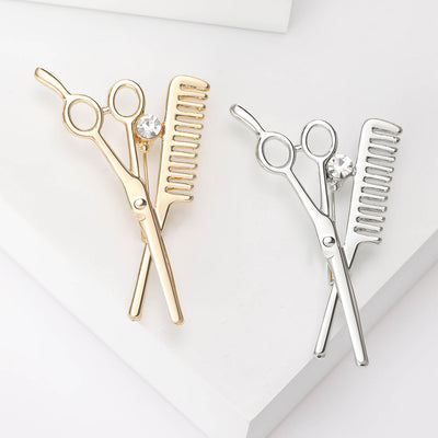 Front view of the scissors and comb brooch
