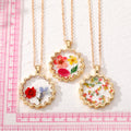 Gold Tone Scalloped Resin Pressed Flower Pendant Necklaces in Seven Designs view 5