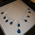 Silver Tone Blue Teardrop Necklace And Long Earrings With Halos view 6
