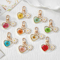Gold Tone Daisy and Pressed Flower Heart Snap-Hook Keychains in Ten Options view 1