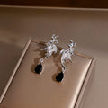 Silver Winged Bat and Black Teardrop Stud Earrings view 1