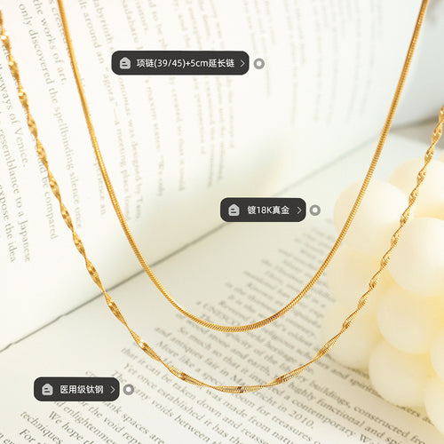 Gold double layer snake twisted necklace on book with size labels