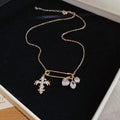 Butterfly and Cross Charm Necklaces in Four Mixed Designs view 6