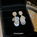 White Shell Disc Drop Earrings with Gold Tone Studs view 4