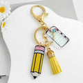 Acrylic Pencil And Notebook Charm Keychain With Yellow Suede Tassel view 3