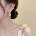 Mini Rose Basket Hoop Earrings in Two Floral Colors view 4