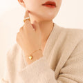 Flat Heart Pendant Twisted Link Bracelet Gold Steel view 1