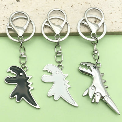 Image 1 showing three key chains with different designs on them.