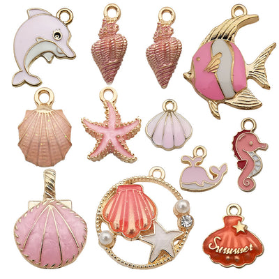 Colorful starfish and seahorse charms arranged on a light background
