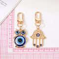Gold and Silver Tone Owl and Hamsa Evil Eye Clip Keychains view 4