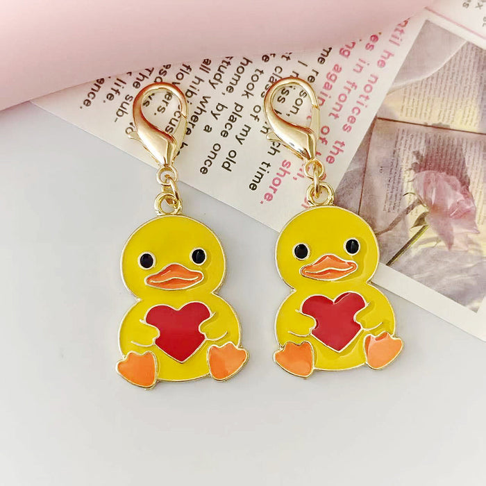 Yellow Heart-Holding Duck Lobster-Clasp Charm with Gold Tone Finish