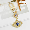 Gold Crystal Evil Eye Keychain With Butterfly And Bear Charm view 4