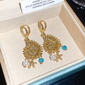 Gold-Tone Seashell And Starfish Pearl Huggie Earrings view 6