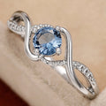 Blue Round Solitaire Wave Ring In Polished Silver Tone view 4