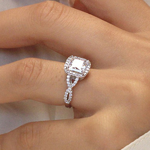 Second product view showing silver-tone cushion solitaire halo infinity-band ring